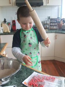 Young Blind Week supporter, Ethan Garland, enjoys crushing Jaffas to make a batch of Juffins.